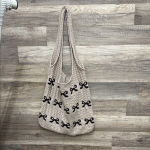 Elegant Beige Tote Bag with Black Bow Accents